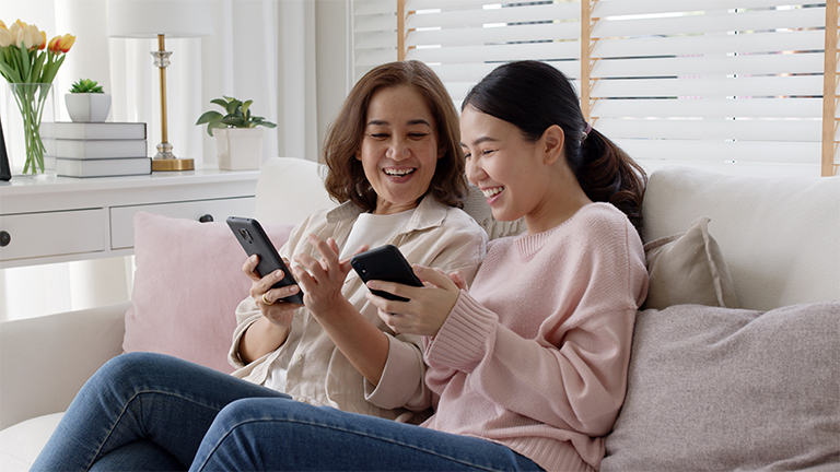 Mom and daughter on phones talking about safety